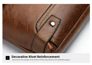 Detail of brown leather briefcase with reinforced metal rivets and stitching