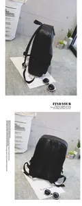 Detail view of black PU leather backpack showing breathable mesh back and side pocket