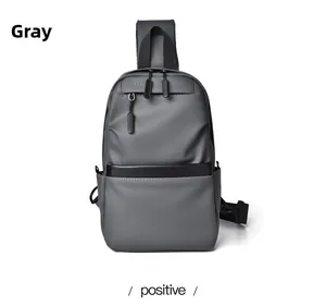 Detailed front view of grey water-resistant chest bag with matte finish and dual zippers