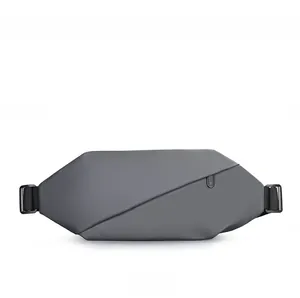 Side angle of grey water-resistant chest bag showing zipper and adjustable nylon strap