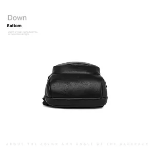 Detailed bottom view of black leather chest bag showing texture and fine stitching