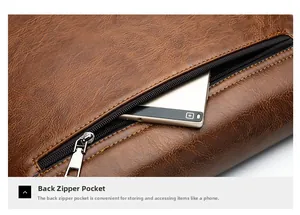 Detail of back zipper pocket on brown leather briefcase showing storage for mobile phone