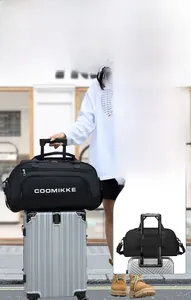 Travel bag with back sleeve for suitcase attachment and convenient front zipper pocket