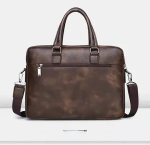 Rear view of brown business briefcase with silver metal zipper and textured leather