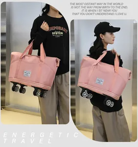 Sac de voyage rose avec roues et tissu résistant à l'eau pour sport ou voyage