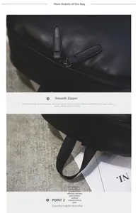 Detail of dual zippers and fabric top handle on black pebbled leather travel backpack