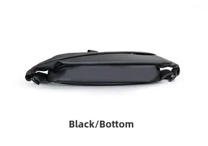 Detailed bottom view of black waterproof nylon sling bag showing durable base and texture