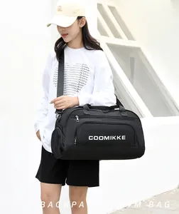 Practical large capacity black gym bag with shoe compartment shown on model