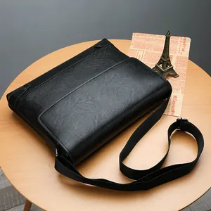 Classic black leather business briefcase for men with adjustable woven shoulder strap