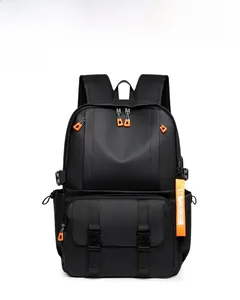 Close-up of black waterproof backpack with multiple compartments and orange zipper pulls