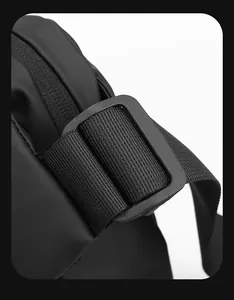 Detailed macro view of durable nylon strap and matte plastic buckle on crossbody bag