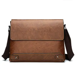 Retro brown leather briefcase messenger bag with adjustable shoulder strap and metal rivets