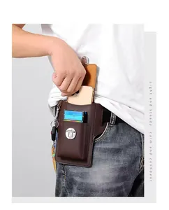 Detailed close-up of a brown leather waist bag showing multi-compartment storage and key hook