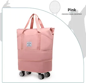 Pink waterproof travel bag with 4 multi-directional spinner wheels and side handle