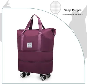 Detail of expandable large purple travel bag with wheels and waterproof fabric