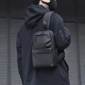 Waterproof black minimalist chest bag for men showing multi-pocket urban commuter style