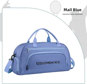 Detail view of water-resistant nylon travel bag with shoulder strap and COOMIKKE logo