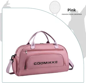 Pink waterproof travel bag with separate shoe compartment and adjustable shoulder strap