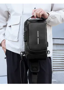 Black leather chest bag with anti-theft combination lock and USB charging port detail