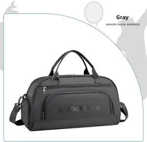 Detail of gray travel bag showing front zipper pocket and embossed logo texture