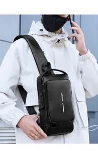 Detail of men's leather chest bag featuring anti-theft combination lock and USB charging port