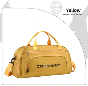 Detail of yellow waterproof yoga bag with shoe compartment and COOMIKKE logo print