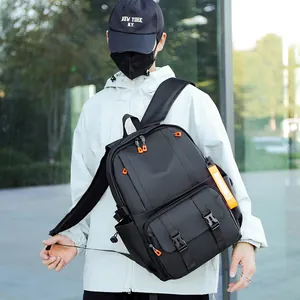 Large capacity black waterproof backpack for travel with orange accents and buckle