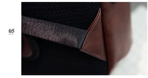 Détail du dos en filet respirant et coutures en cuir marron sur le sac à dos de voyage