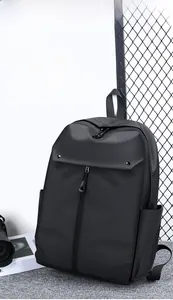 Macro detail of a lightweight black commuter backpack made of waterproof oxford fabric
