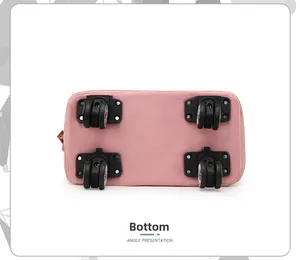 Detail view of the pink travel bag's bottom featuring four durable 360-degree swivel wheels