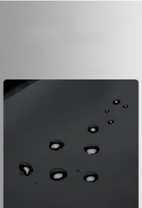 Close-up of waterproof black fabric with water droplets on a durable commuter backpack