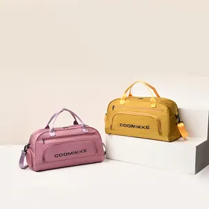 Large travel duffel bag with shoe compartment in pink and yellow for yoga and fitness