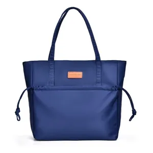 Large dark blue tote bag with drawstring pocket and smooth nylon finish for daily use