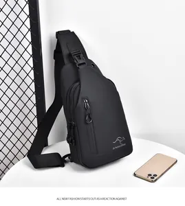 Detail view of black waterproof crossbody chest bag with adjustable strap and multiple zippers