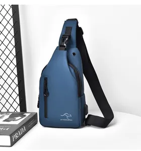 Close-up of blue waterproof sling bag showing the USB charging port and logo details