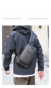 Detail of waterproof crossbody chest bag featuring anti-theft lock and USB charging port