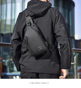 Close-up of matte black waterproof chest bag featuring USB port and kangaroo logo