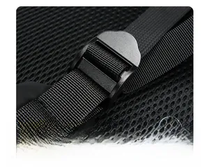 Detail of adjustable strap buckle and durable nylon webbing on black backpack