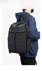 Front view of black business backpack with large zipper pockets and water bottle side pouch