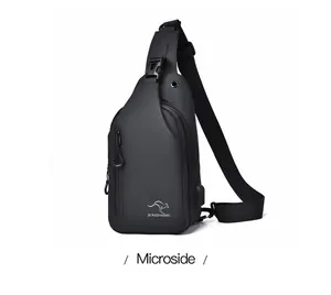 Side view of black waterproof chest bag showing USB port and multi-layer zippers