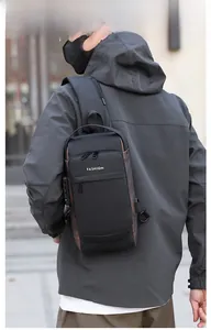 Detail of waterproof crossbody bag with security lock and external USB charging port
