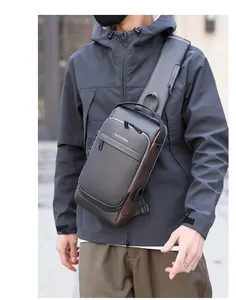 Detail of grey crossbody bag featuring anti-theft combination lock and USB charging port
