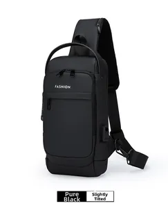 Detail of black crossbody chest bag with USB charging port and breathable mesh strap