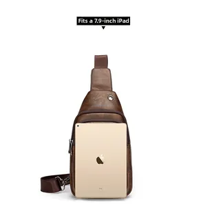 Front view of vintage brown chest bag showing capacity for a 7.9-inch tablet and headphone port