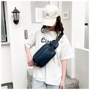 Outdoor model shot showing fit and navy blue nylon chest bag with adjustable strap