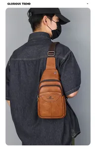 Close-up of brown vintage leather chest bag with multi-pocket zippers and adjustable strap