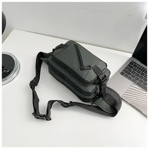 Macro view of multi-pocket waterproof Oxford fabric chest bag on a modern office desk