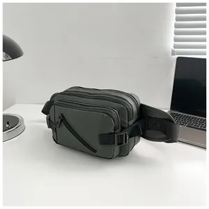 Detailed view of olive green waterproof oxford cloth waist bag with multi-layer zippers