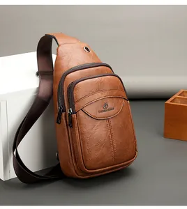 Detail of vintage brown synthetic leather chest bag with zipper compartments and embossed logo