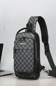 Detail view of water-resistant checkerboard sling bag with anti-theft lock and USB port